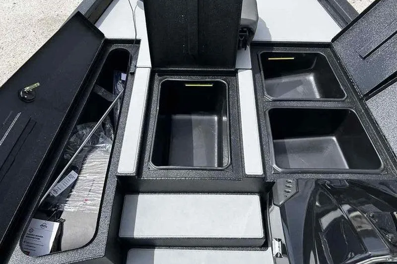 Slide: The Image of 2026 Xpress H18 Bay boat storage compartments and livewells, showcasing organized interior layout. - 4