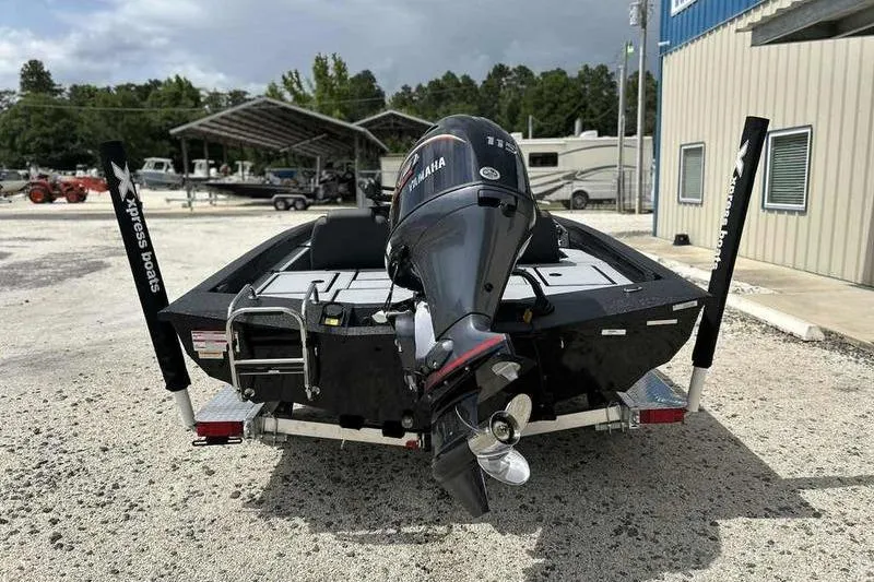 Slide: The Image of 2026 Xpress H18 Bay boat with Yamaha outboard motor on trailer. - 7