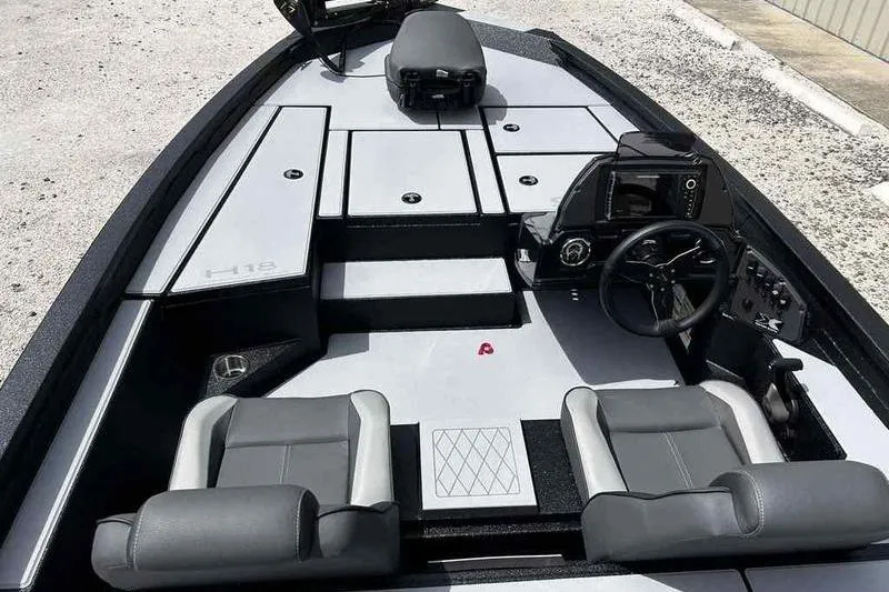 Slide: The Image of 2026 Xpress H18 Bay boat interior with dual seats and modern dashboard. - 9