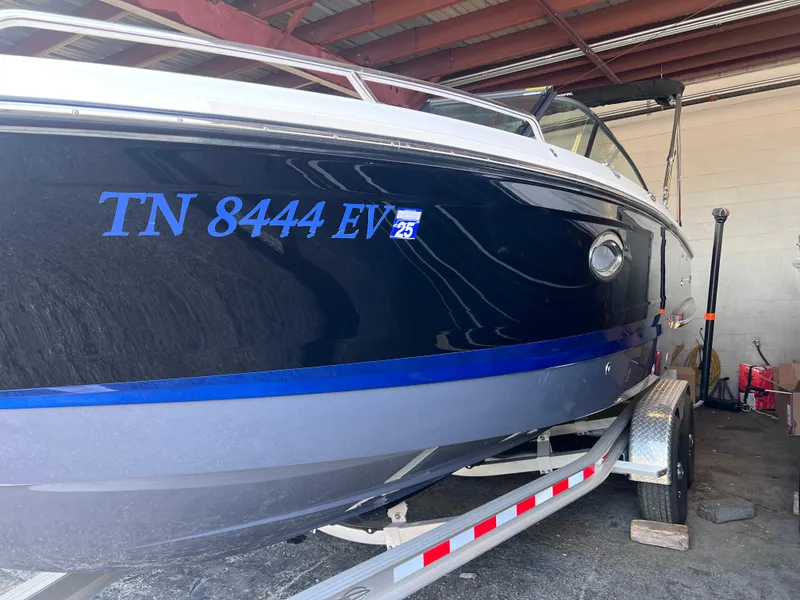 Slide: The Image of 2022 Chaparral 267 SSX boat on trailer, side view with registration number TN 8444 EV. - 10