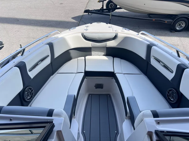 Slide: The Image of 2022 Chaparral 267 SSX boat interior with spacious seating and modern design. - 12