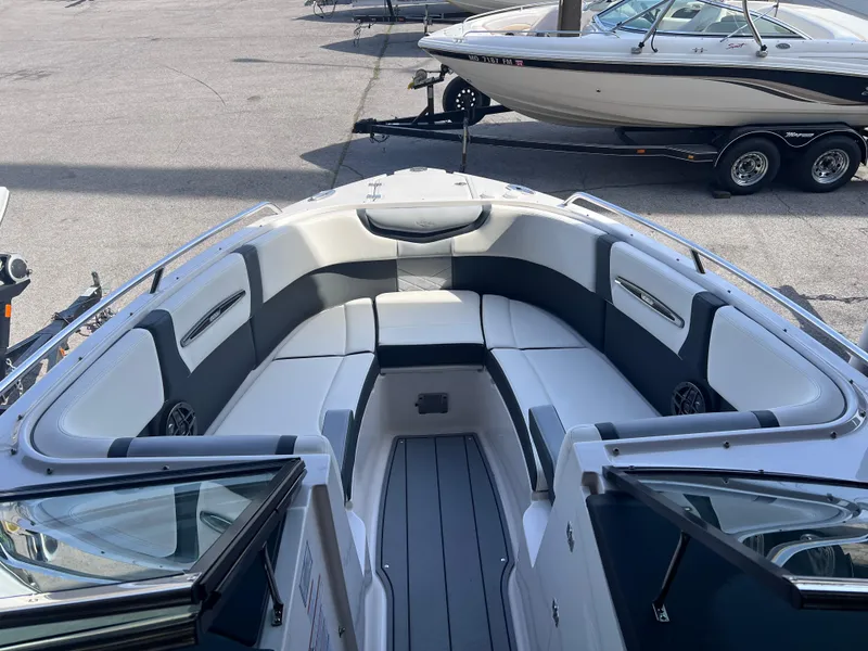Slide: The Image of 2022 Chaparral 267 SSX boat interior with spacious seating and modern design. - 13
