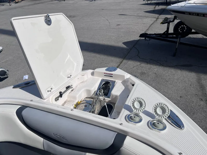 Slide: The Image of 2022 Chaparral 267 SSX boat with open anchor storage compartment. - 14