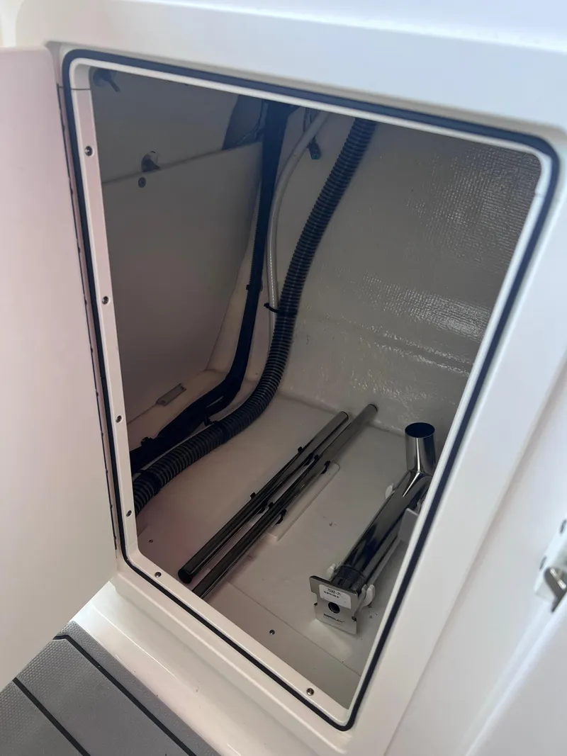 Slide: The Image of Storage compartment of a 2022 Chaparral 267 SSX boat. - 19