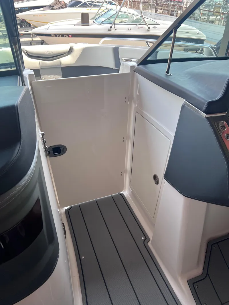 Slide: The Image of 2022 Chaparral 267 SSX boat interior with sleek design and modern features. - 20