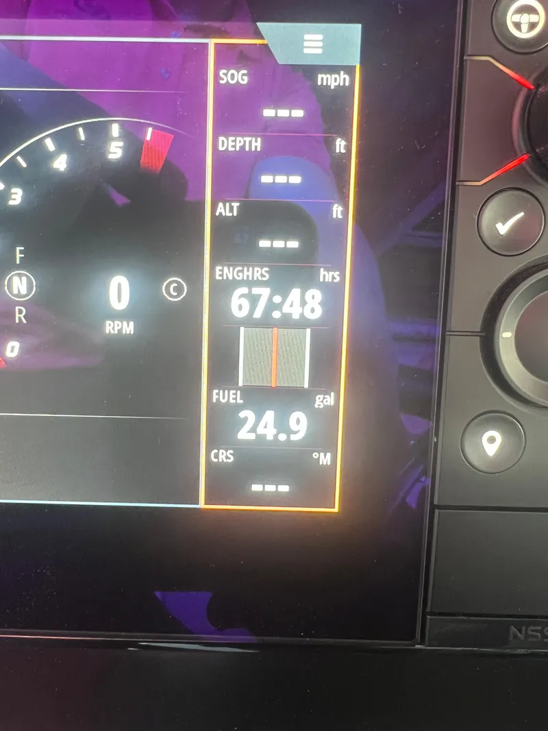 Slide: The Image of Digital dashboard of a 2022 Chaparral 267 SSX showing engine hours and fuel level. - 28