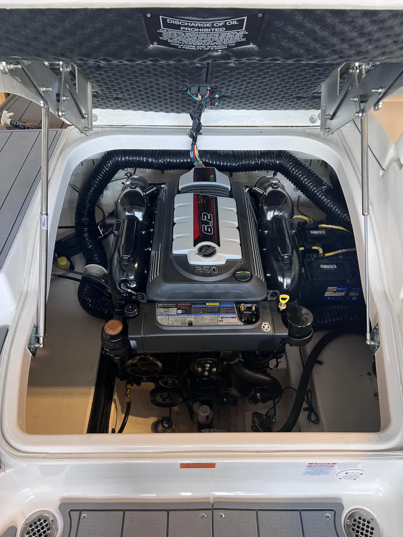 Slide: The Image of 2022 Chaparral 267 SSX boat engine compartment with open hatch. - 37