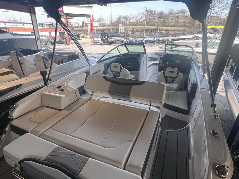 Slide: The Image of 2022 Chaparral 267 SSX boat interior with spacious seating and modern design. - 39