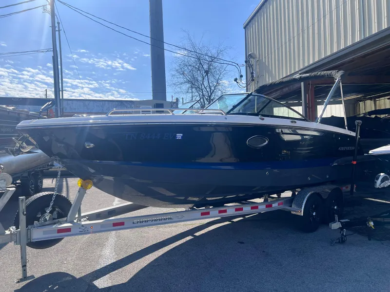 Slide: The Image of 2022 Chaparral 267 SSX boat on a trailer in a marina. - 4