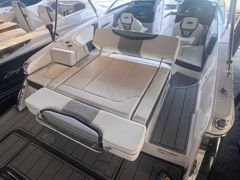 Slide: The Image of 2022 Chaparral 267 SSX boat interior with luxurious seating and modern design. - 40