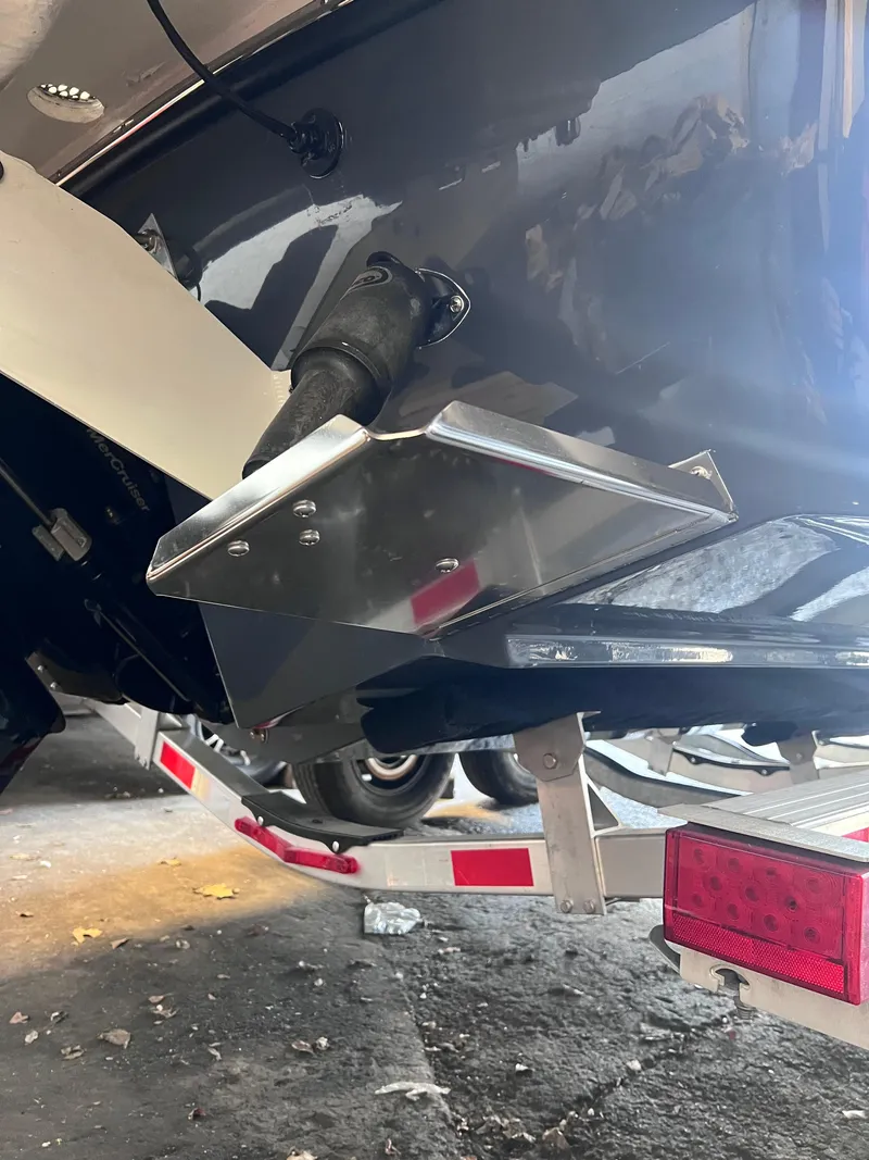 Slide: The Image of 2022 Chaparral 267 SSX boat on trailer, close-up of stern and propeller. - 45