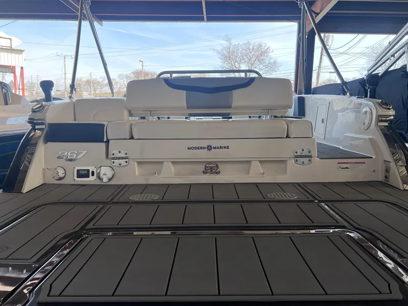 Slide: The Image of 2022 Chaparral 267 SSX boat rear view with modern marine design. - 48
