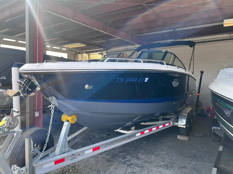 Slide: The Image of 2022 Chaparral 267 SSX boat on a trailer in a covered storage area. - 6