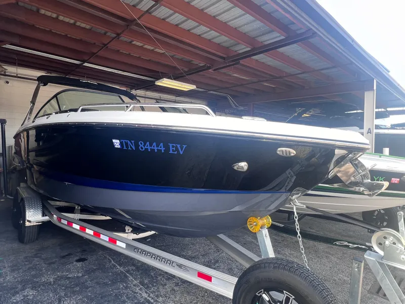 Slide: The Image of 2022 Chaparral 267 SSX boat on trailer in covered storage. - 7
