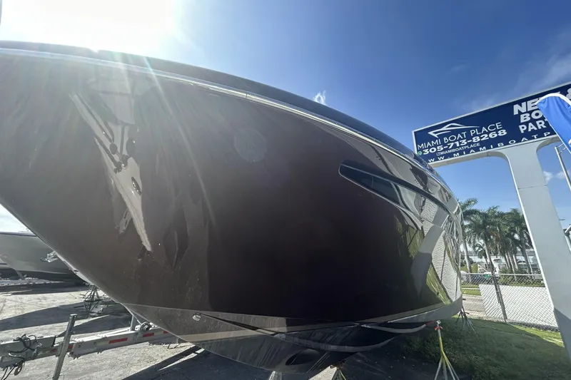 Slide: The Image of 2005 Riva RivaRama 44 yacht displayed at Miami Boat Place under sunny skies. - 14