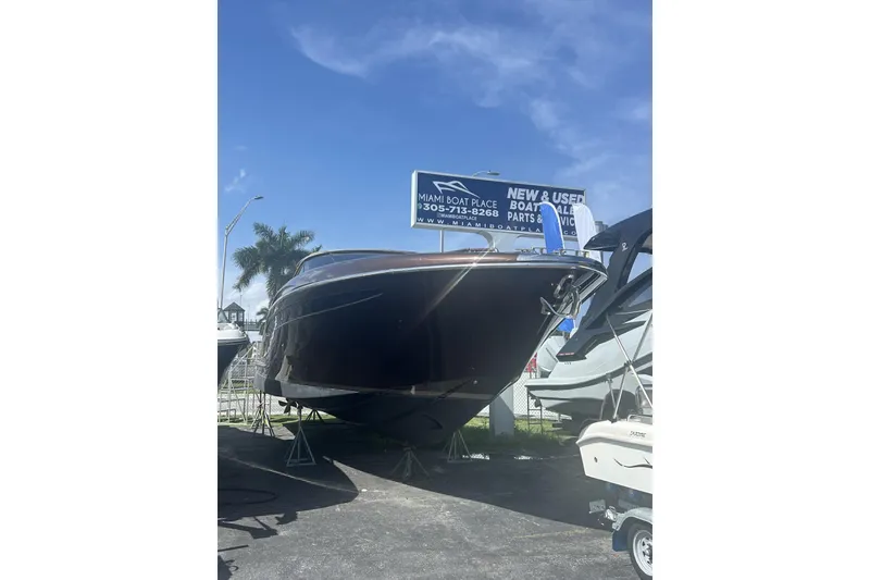 Slide: The Image of 2005 Riva RivaRama 44 luxury boat displayed at Miami Boat Place under clear blue sky. - 21