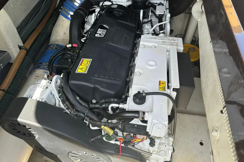 Slide: The Image of Engine compartment of a 2005 Riva RivaRama 44 yacht, showcasing detailed machinery. - 25