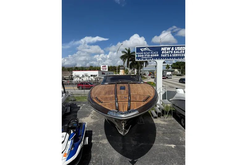 Slide: The Image of 2005 Riva RivaRama 44 boat displayed at Miami Boat Place under clear skies. - 27