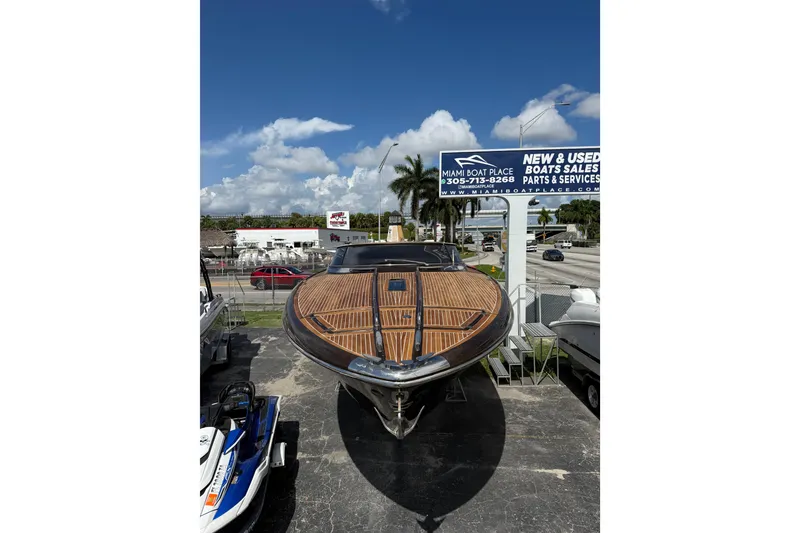 Slide: The Image of 2005 Riva RivaRama 44 luxury boat displayed at Miami Boat Place under clear blue skies. - 28
