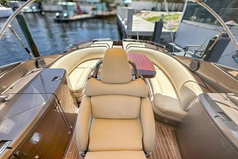 Slide: The Image of Luxurious 2005 Riva RivaRama 44 yacht interior with elegant seating and wooden accents. - 7