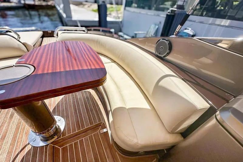 Slide: The Image of Luxurious 2005 Riva RivaRama 44 yacht interior with elegant wood table and cream seating. - 8