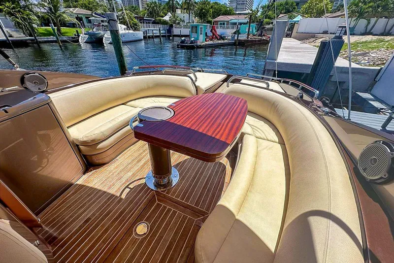 Slide: The Image of Luxurious 2005 Riva RivaRama 44 yacht interior with elegant seating and wooden table. - 11