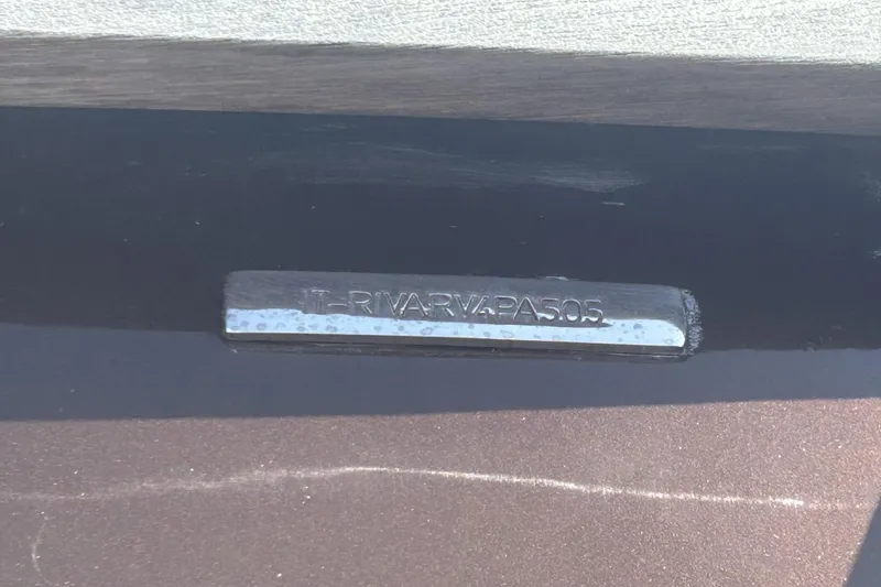 Slide: The Image of Close-up of a 2005 Riva RivaRama 44 nameplate on a boat. - 17