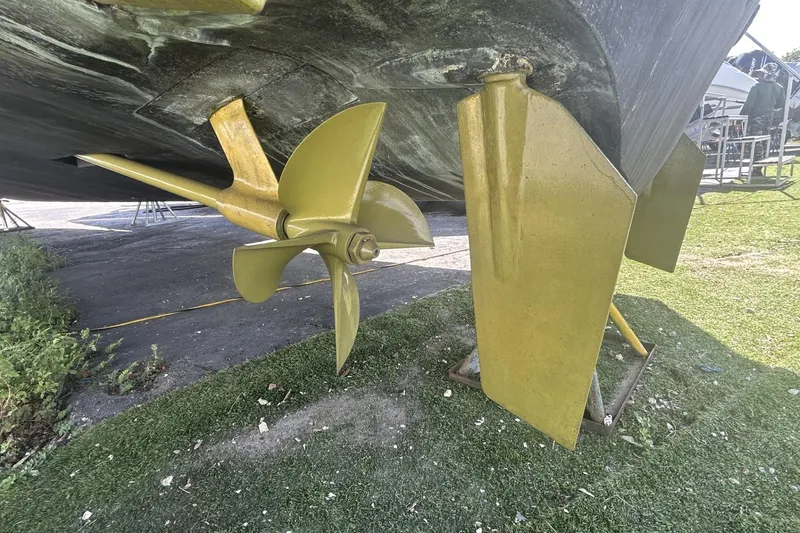 Slide: The Image of Close-up of 2005 Riva RivaRama 44 boat propeller and rudder on dry land. - 22