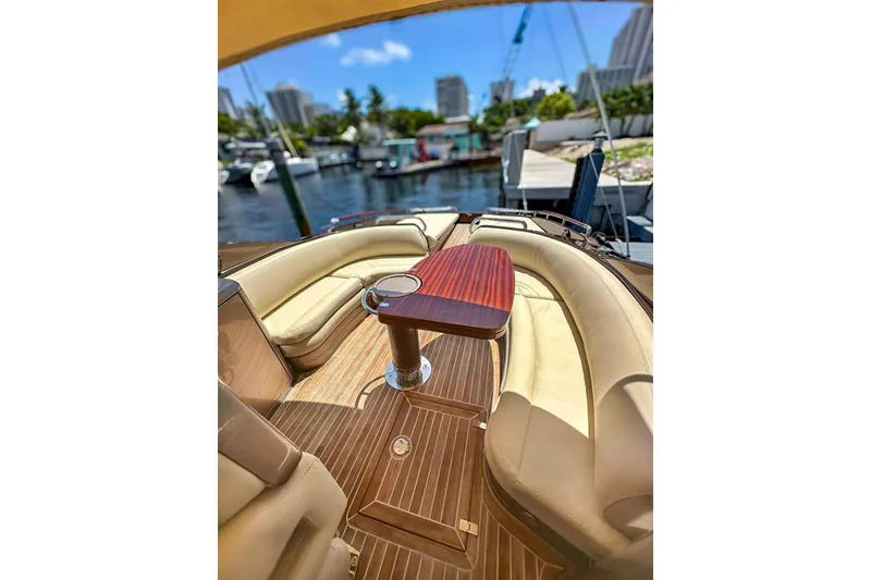 Slide: The Image of Luxurious 2005 Riva RivaRama 44 yacht interior with elegant seating and wooden table. - 5