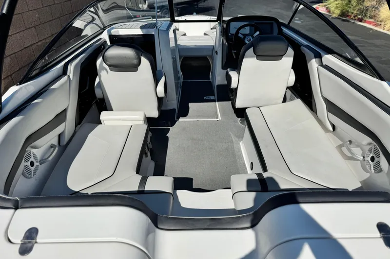Slide: The Image of 2020 Yamaha Boats AR240 interior with sleek seating and modern design. - 13