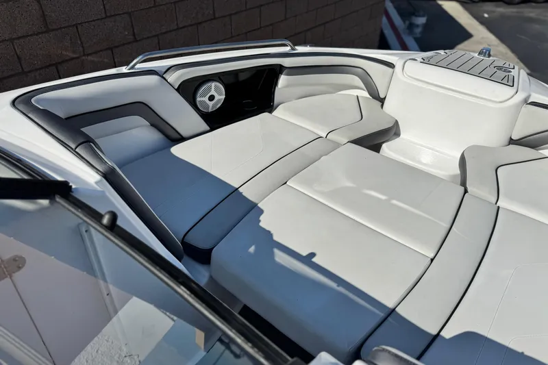 Slide: The Image of 2020 Yamaha Boats AR240 interior seating with sleek, modern design and comfortable upholstery. - 15