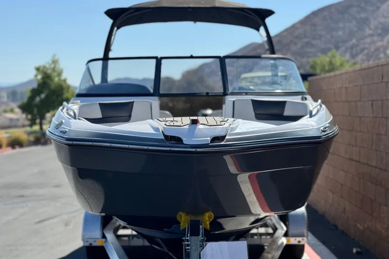 Slide: The Image of 2020 Yamaha Boats AR240 on trailer, parked outdoors with mountain backdrop. - 2