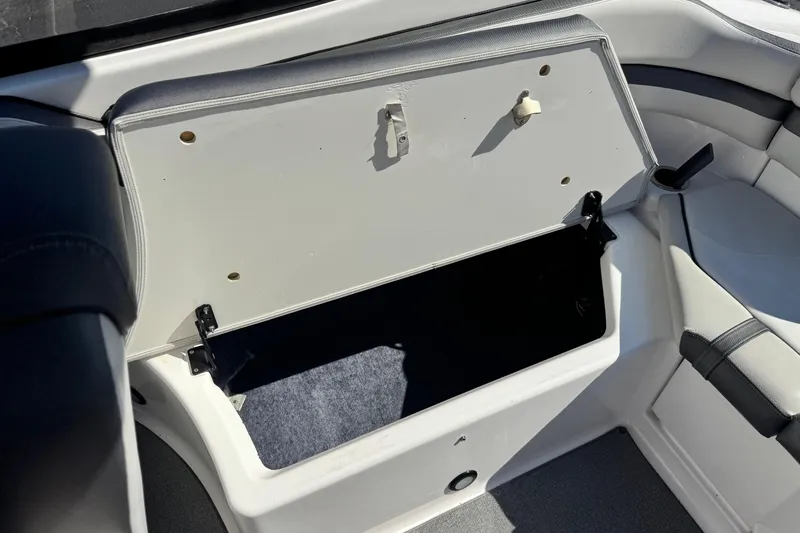 Slide: The Image of Open storage compartment in 2020 Yamaha AR240 boat interior. - 20
