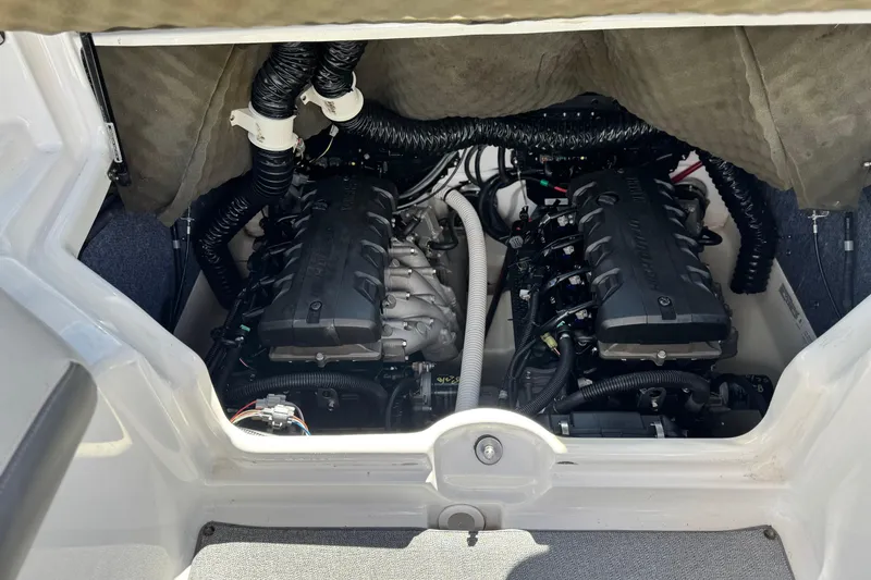 Slide: The Image of 2020 Yamaha Boats AR240 engine compartment with dual engines and wiring. - 22