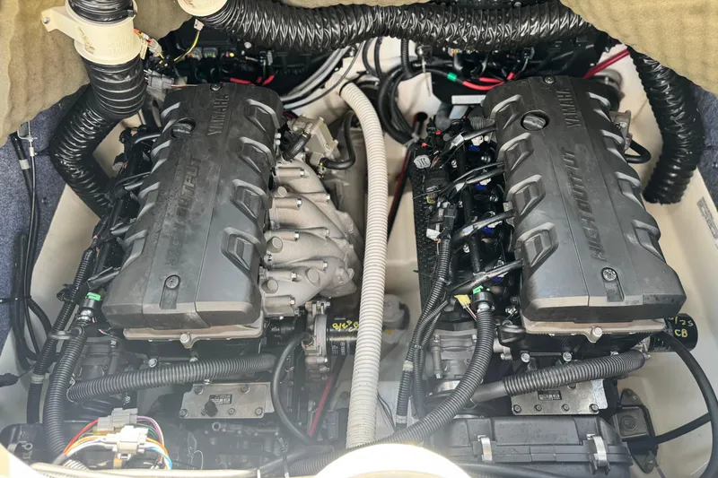 Slide: The Image of 2020 Yamaha AR240 boat engine compartment with dual high-output engines. - 23