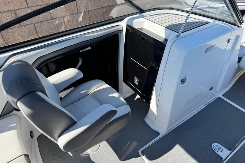 Slide: The Image of 2020 Yamaha Boats AR240 interior with captain's chair and sleek dashboard design. - 24