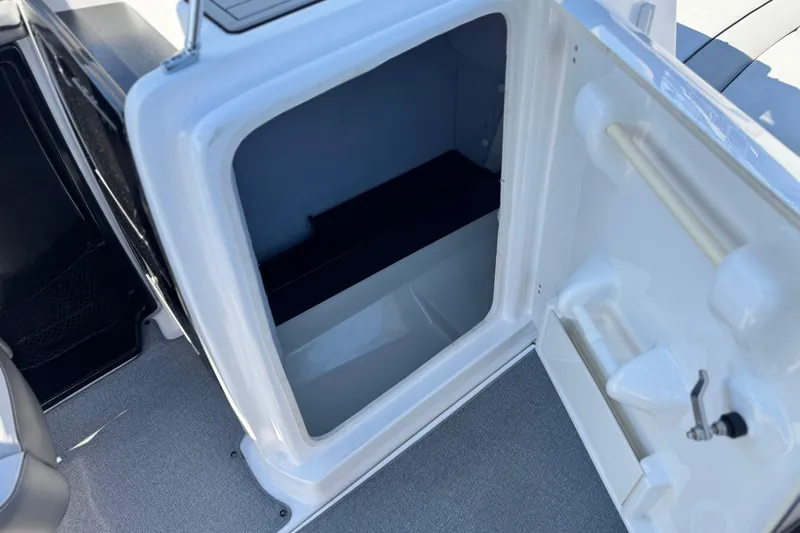 Slide: The Image of Open storage compartment on a 2020 Yamaha AR240 boat, showcasing interior space. - 25