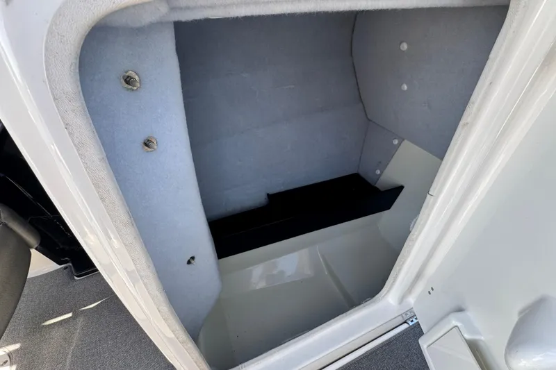 Slide: The Image of 2020 Yamaha AR240 boat storage compartment with carpeted interior. - 26