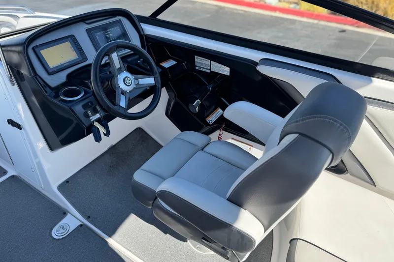 Slide: The Image of 2020 Yamaha Boats AR240 cockpit with steering wheel and control panel. - 27