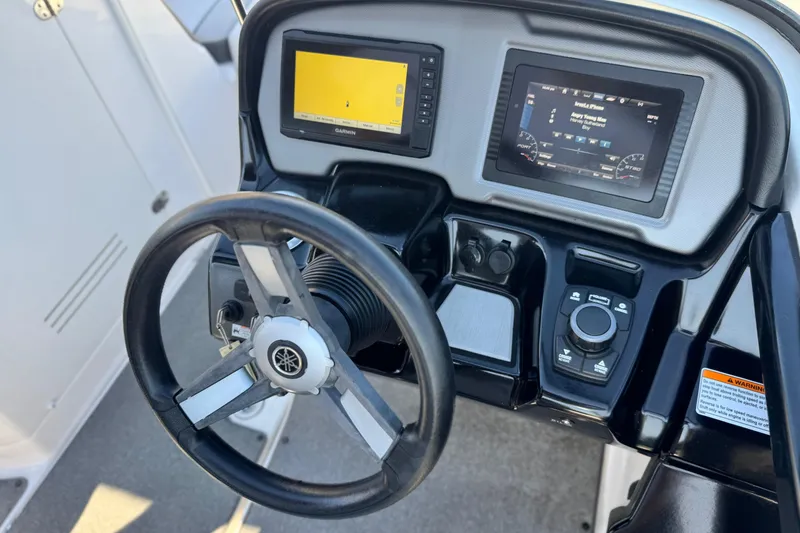 Slide: The Image of 2020 Yamaha AR240 boat dashboard with steering wheel and digital displays. - 29