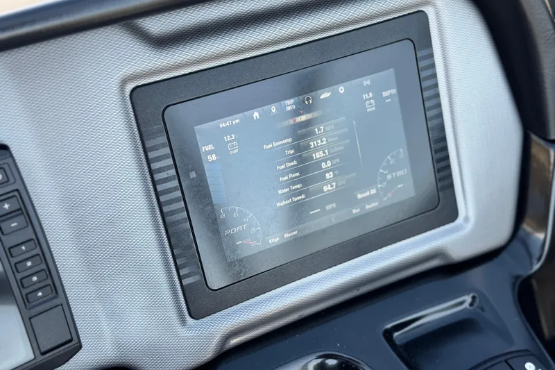 Slide: The Image of Dashboard display of a 2020 Yamaha Boats AR240 showing trip and fuel information. - 32