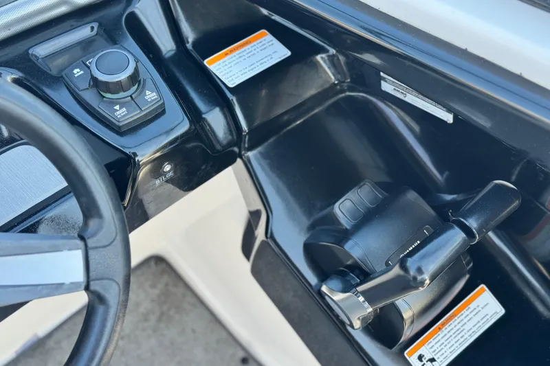 Slide: The Image of 2020 Yamaha Boats AR240 control panel with steering wheel and throttle lever. - 34