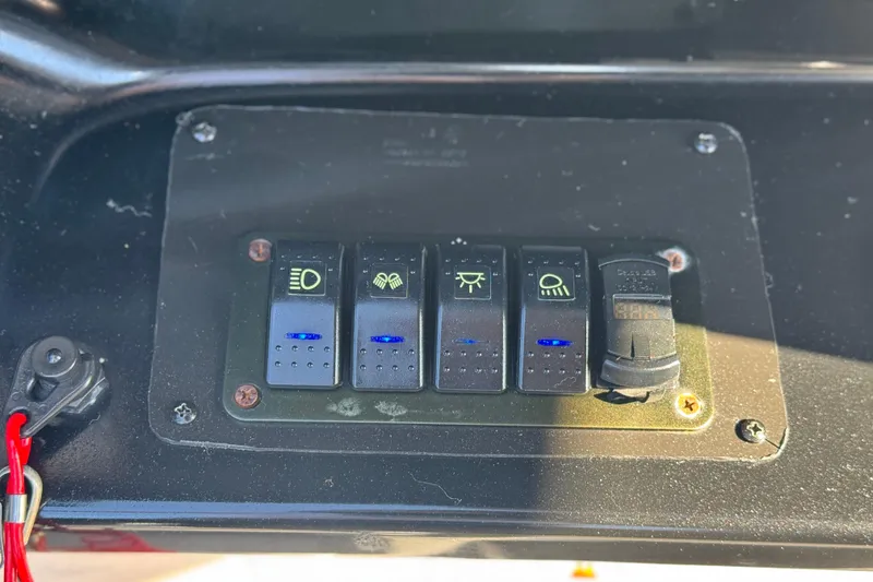 Slide: The Image of Control panel of a 2020 Yamaha AR240 boat with illuminated switches. - 35