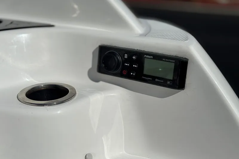 Slide: The Image of 2020 Yamaha AR240 boat console with Fusion stereo system and cup holder. - 8