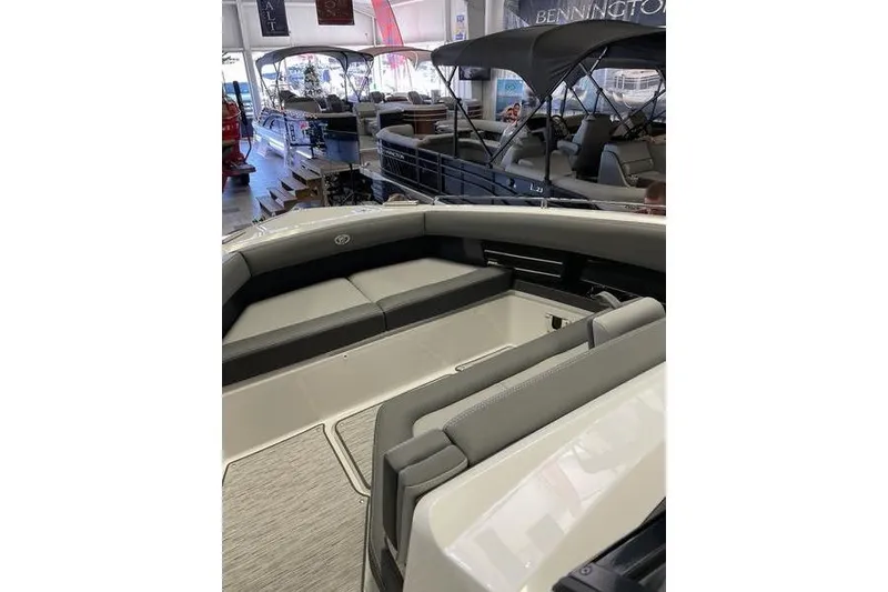 Slide: The Image of 2021 Cobalt A29 boat interior with gray seating in showroom. - 12