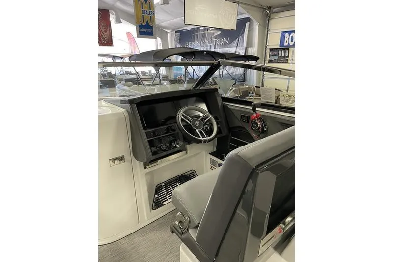 Slide: The Image of 2021 Cobalt A29 boat interior with steering wheel and dashboard controls. - 15