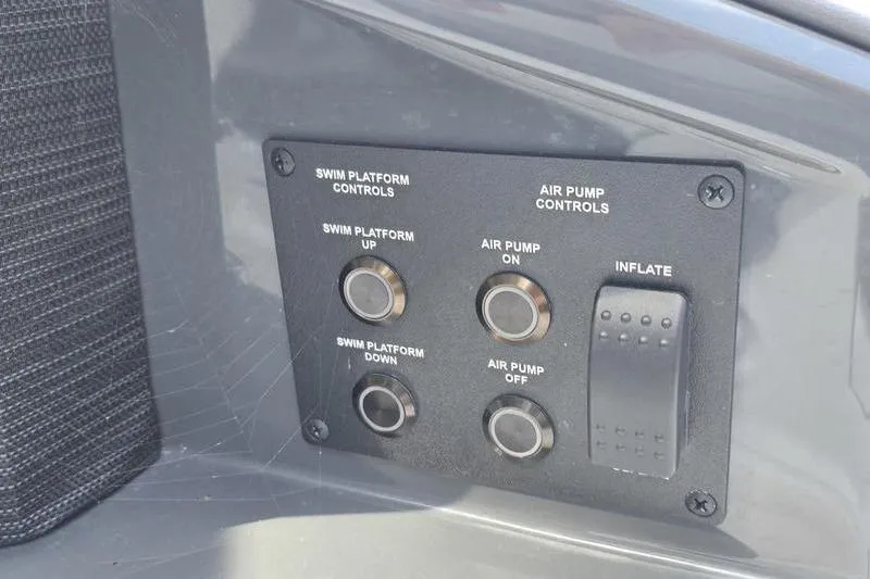 Slide: The Image of Control panel on a 2021 Cobalt A29 boat for swim platform and air pump. - 7