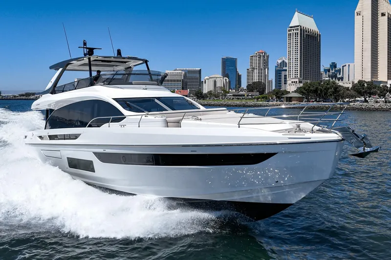 Slide: The Image of 2026 Azimut Fly 72 yacht cruising near city skyline on a sunny day. - 10