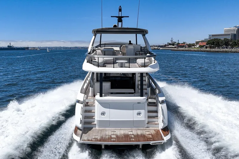Slide: The Image of 2026 Azimut Fly 72 yacht cruising on open water, rear view. - 14