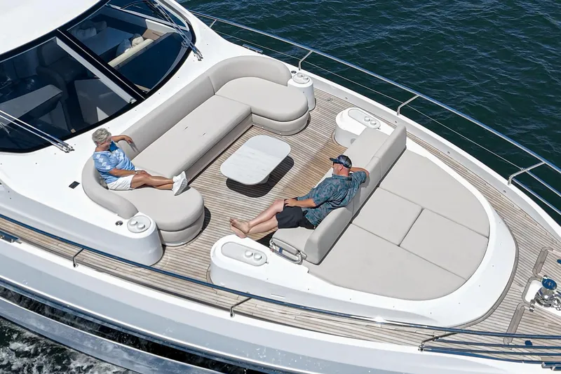 Slide: The Image of Luxury deck of 2026 Azimut Fly 72 yacht with two people relaxing. - 17